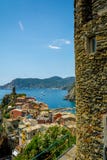 Vertical View of the Town of Vernazza on blue Sea and the Coastline of the Liguria Background. royalty free stock photography Vertical View of the Town of Vernazza on blue Sea and the Coastline of the Liguria Background. royalty free stock photography