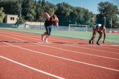 Very dynamic leap from the start of the white men Stock Images Very dynamic leap from the start of the white men Stock Images