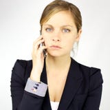 Verärgerte Geschäftsfrau am Telefon lizenzfreies stockbild Verärgerte Geschäftsfrau am Telefon lizenzfreies stockbild