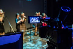 Video recording of the concert. Girls sing in microphones. Camcorder with LCD display. Shooting in the interior stock photography Video recording of the concert. Girls sing in microphones. Camcorder with LCD display. Shooting in the interior stock photography