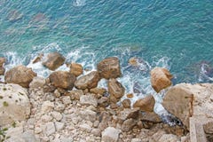 View from Above on the Sea and Stones or Rocks in the City of Taormina. The island of Sicily, Italy. Beautiful and Scenic View of stock image View from Above on the Sea and Stones or Rocks in the City of Taormina. The island of Sicily, Italy. Beautiful and Scenic View of stock image