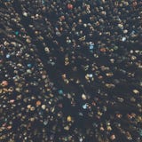 A view from above to the crowd of people gathering for an event. Crowed open-air meeting of people shot from a height. Night-time stock images A view from above to the crowd of people gathering for an event. Crowed open-air meeting of people shot from a height. Night-time stock images