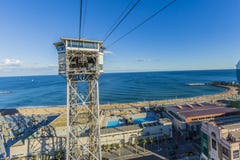 View of Barceloneta beach with the tower of its Harbor cable car royalty free stock images View of Barceloneta beach with the tower of its Harbor cable car royalty free stock images