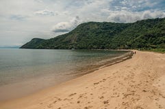 View of beach, sea and forest on cloudy day in Paraty Mirim, a tropical beach near Paraty. stock images View of beach, sea and forest on cloudy day in Paraty Mirim, a tropical beach near Paraty. stock images