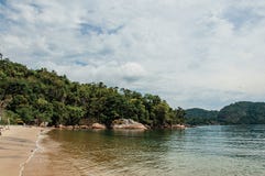 View of beach, sea and forest on cloudy day in Paraty Mirim. royalty free stock images View of beach, sea and forest on cloudy day in Paraty Mirim. royalty free stock images