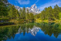 View of the Blue lake Lago Blu near Breuil-Cervinia and Cervino Mount Matterhorn in Val D`Aosta,Italy. stock photography View of the Blue lake Lago Blu near Breuil-Cervinia and Cervino Mount Matterhorn in Val D`Aosta,Italy. stock photography