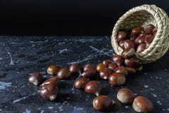 View of chestnuts falling from a wicker basket