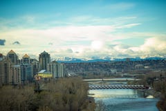 View of downtown Calgary with bridges and the rockies