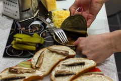 View of the hands of the girl who makes breakfast by opening a c stock images View of the hands of the girl who makes breakfast by opening a c stock images