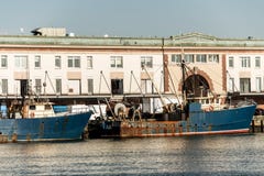 View of harbor from the Boston Waterfront with fishing boat trucks and boats anchored Massachusets stock photo View of harbor from the Boston Waterfront with fishing boat trucks and boats anchored Massachusets stock photo