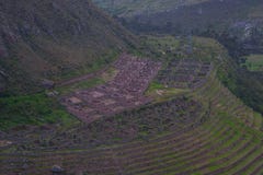 view-high-peak-along-paved-path-inca-trail-to-machu-picchu-ancient-ruins-agriculture-centers-terraces-ruins-120709661.jpg