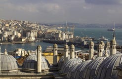 View on Istanbul acros bosphorus. Towers and domes, strait with sailing ships and colorful city stock photos View on Istanbul acros bosphorus. Towers and domes, strait with sailing ships and colorful city stock photos