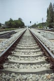 View of the length of railway with green tree at left and right side of railway.filtered image. stock photography View of the length of railway with green tree at left and right side of railway.filtered image. stock photography