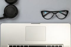 Desk with laptop, glasses and other items royalty free stock photo Desk with laptop, glasses and other items royalty free stock photo
