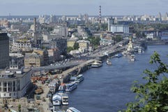 View of right side of Dnieper river, riverside, buildings and river port, pleasure boat floating on water royalty free stock photos View of right side of Dnieper river, riverside, buildings and river port, pleasure boat floating on water royalty free stock photos