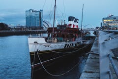 View on the river Clyde and the old steamer on the dock in the evening royalty free stock image View on the river Clyde and the old steamer on the dock in the evening royalty free stock image