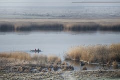 View of the river, on which the fishermen sail in a boat royalty free stock images View of the river, on which the fishermen sail in a boat royalty free stock images