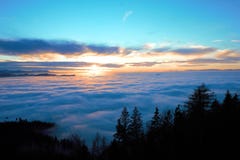 View on sea of fog with some hills sticking out of the mist stock images View on sea of fog with some hills sticking out of the mist stock images