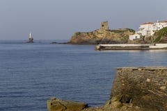 View of the town lighthouse, fortress, church and the sea Greece, island Andros, Cyclades stock photos View of the town lighthouse, fortress, church and the sea Greece, island Andros, Cyclades stock photos