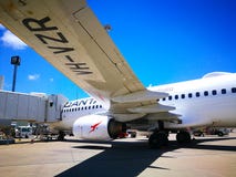The view under the plane left wing of Qantas domestic airline Aircraft Type: Boeing 737 on the runway. royalty free stock images The view under the plane left wing of Qantas domestic airline Aircraft Type: Boeing 737 on the runway. royalty free stock images