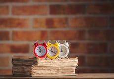 Vintage alarm clocks and old books royalty free stock images Vintage alarm clocks and old books royalty free stock images