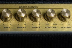 Vintage amplifier five knobs horizontal closeup, music recording studio equipment, bottom copy space royalty free stock photo Vintage amplifier five knobs horizontal closeup, music recording studio equipment, bottom copy space royalty free stock photo