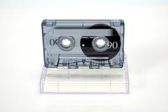 Vintage audio compact cassette. Cassette on a white background, front view with box royalty free stock photo Vintage audio compact cassette. Cassette on a white background, front view with box royalty free stock photo