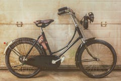 Vintage black ladies bicycle parked in an old factory Royalty Free Stock Images Vintage black ladies bicycle parked in an old factory Royalty Free Stock Images