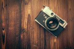 Vintage camera on wooden background royalty free stock photography Vintage camera on wooden background royalty free stock photography