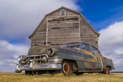 Vintage Car And Rustic Barn. Royalty Free Stock Photo