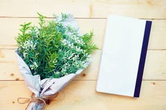 Vintage concept, top view image of blank pages with flower bouquet on wooden background. royalty free stock photography Vintage concept, top view image of blank pages with flower bouquet on wooden background. royalty free stock photography