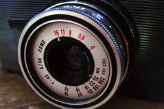 Old photo camera on wooden background. Vintage retro style poster stock photography Old photo camera on wooden background. Vintage retro style poster stock photography