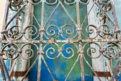 Vintage forged iron ornaments; colorful wall background, California stock photo Vintage forged iron ornaments; colorful wall background, California stock photo