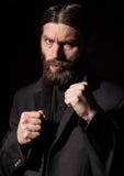 Vintage handsome bearded man. severe man on a dark background. free space for your text stock photo Vintage handsome bearded man. severe man on a dark background. free space for your text stock photo