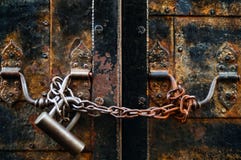 Vintage lock on a rusty loop on an iron door, concept of authentic objectsn stock photos Vintage lock on a rusty loop on an iron door, concept of authentic objectsn stock photos