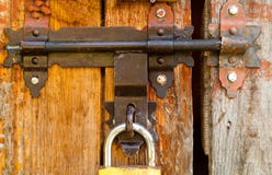 Vintage lock on a rusty loop on a wooden background, copy space,concept of authentic objects stock photos Vintage lock on a rusty loop on a wooden background, copy space,concept of authentic objects stock photos