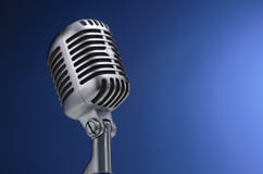 Vintage microphone on blue. Background Vintage microphone on blue. Background