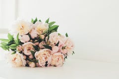 Vintage peony bouquet on white table Stock Photos Vintage peony bouquet on white table Stock Photos