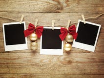 Vintage photo frames decorated for Christmas on the wooden board background with space for your text Royalty Free Stock Image Vintage photo frames decorated for Christmas on the wooden board background with space for your text Royalty Free Stock Image