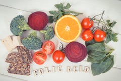 Vintage photo, Inscription folic acid with nutritious ingredients containing vitamin B9, natural minerals and folic acid, healthy stock image Vintage photo, Inscription folic acid with nutritious ingredients containing vitamin B9, natural minerals and folic acid, healthy stock image