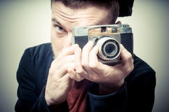 Vintage Portrait Of Fashion Guy With Old Camera Stock Photography