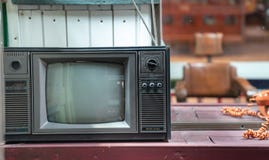 Vintage retro black and white color tv on wooden table with copy space stock photos Vintage retro black and white color tv on wooden table with copy space stock photos