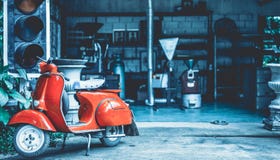 Antique Red Scooter Motorcycle Display stock photography Antique Red Scooter Motorcycle Display stock photography