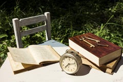 Vintage still life with old alarm clock, keys and books royalty free stock photos Vintage still life with old alarm clock, keys and books royalty free stock photos