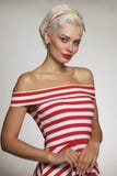 Vintage style portrait of young beautiful blond woman in striped royalty free stock images Vintage style portrait of young beautiful blond woman in striped royalty free stock images