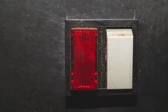 Vintage Switch With A Red Indicator On A Black Background