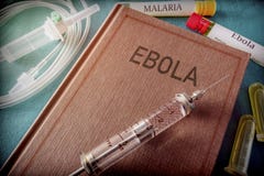 Vintage Syringe On A Book Of Ebola stock photography Vintage Syringe On A Book Of Ebola stock photography