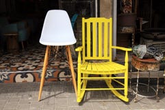 Vintage yellow rocking chair and lamp on flea market stock photography Vintage yellow rocking chair and lamp on flea market stock photography