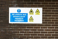 Visitors and drivers report to reception sign at work royalty free stock image Visitors and drivers report to reception sign at work royalty free stock image
