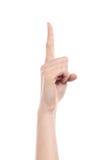 Vista laterale di una mano della donna che gesturing numero uno fotografia stock libera da diritti Vista laterale di una mano della donna che gesturing numero uno fotografia stock libera da diritti